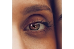 Image Zoomed in image of a womans eye.